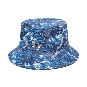 Reversible bucket hat with Japanese ukiyo-e waves and crane patterns in navy cotton