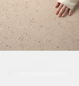 Close-up of light beige woven rug texture with soft hand touch and minimalist style