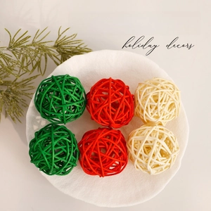 Six pieces of handmade Christmas rattan balls in red green and white for holiday decoration