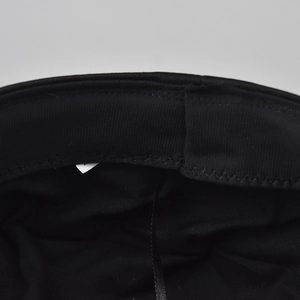 Macro detail of the black textile hat inner lining with sweatband and adjustable drawstring