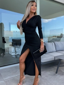 Detail of elegant black V-neck maxi dress featuring slim-fit ruching and high side slit