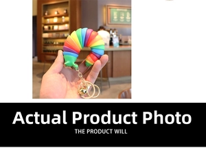 Rainbow articulated slug fidget toy keychain with gold bell and colorful segments