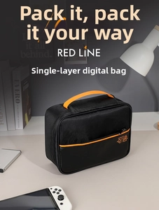 Detail view of black digital accessory organizer bag with orange strap and zipper accents