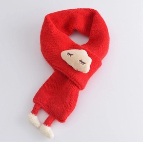 Detail of red knit toddler scarf featuring cute cloud patch with tiny legs and pom-poms