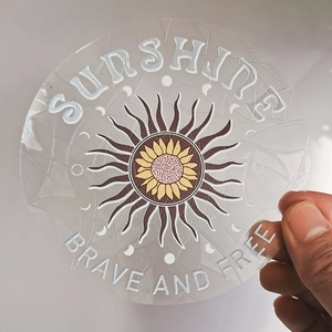 Macro detail of sunflower suncatcher sticker with Sunshine Brave and Free text