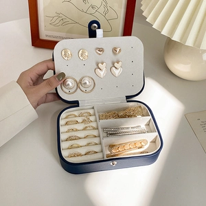 Portable luxury jewelry organizer for rings and earrings with velvet beige interior