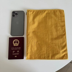 Portable yellow nylon organizer pouch with durable zipper and reinforced stitching edges