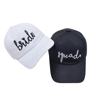 Detail of Bride and Squad embroidery on black and white cotton baseball caps