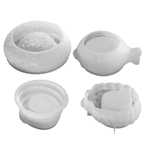 Set of four silicone molds for DIY scented candles featuring rock and wave texture designs