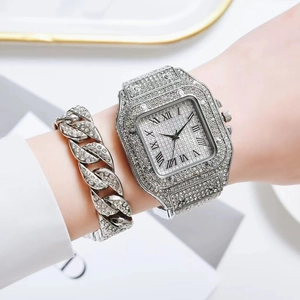 Detail of silver square crystal watch and cuban chain bracelet set on model wrist