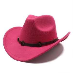 Detail of rose red felt western cowboy hat with vintage metal studs on brown leather band
