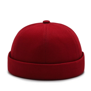 Detailed view of red cotton canvas brimless docker cap with retro stitching texture