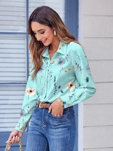 Women's mint green floral long sleeve button-up shirt with lapel collar in outdoor setting