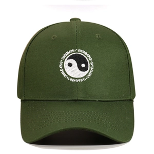 Close-up of Tai Chi embroidery and Swimming text on dark green cotton baseball cap