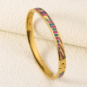 Detailed close-up of a colorful enamel inlay on an 18K gold-plated stainless steel bangle