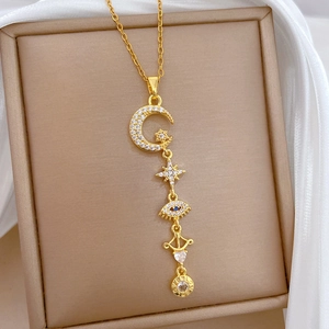 Elegant gold titanium steel necklace featuring celestial charms and sparkling zircons
