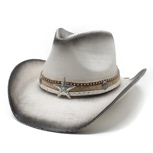 Detail of vintage straw cowboy hat featuring turquoise star buckle and braided cord