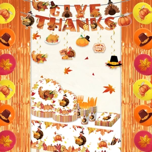 Thanksgiving party set with Give Thanks banner, turkey plates, napkins and festive decorations