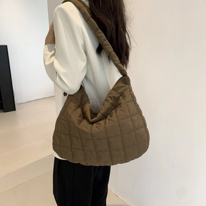 Close-up of brown quilted tote bag in space cotton fabric with large capacity