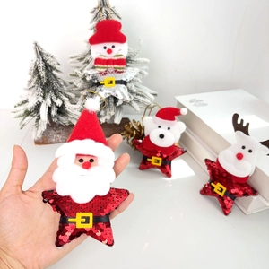 Sparkly sequin star ornaments with Santa and reindeer for festive Christmas tree decor