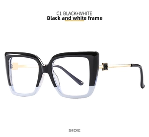 Side view of cat-eye glasses with black and white gradient frames and gold metal temples
