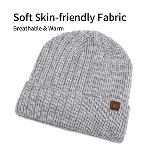 Light gray ribbed knit beanie with brown leather snowflake patch and fold-up cuff