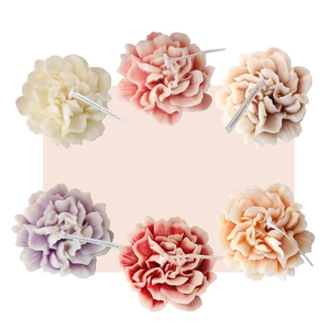 Handmade carnation soy candles in multiple colors for Mother's Day and Valentine's Day gifts