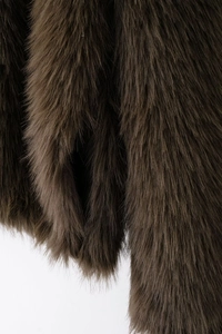 Close-up of soft brown faux fur texture showing premium plush fibers and fluffy material