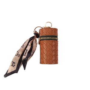 Brown woven leather coin purse with golden clasp and decorative printed silk scarf
