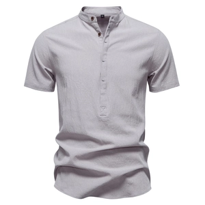 Detail of light grey cotton linen shirt showing stand collar and natural fabric texture