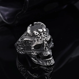 Close-up of gothic skull ring with vintage silver finish and detailed punk metal texture
