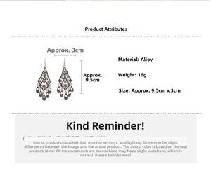 Detail view of vintage hollow flower earrings with teardrop tassel in silver alloy finish