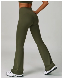 Detail of high-waist olive green flared yoga pants showing heart-shaped back stitching