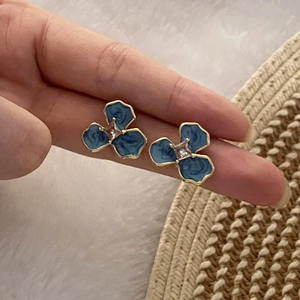 Blue enamel flower stud earrings with marble texture and gold trim for women