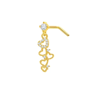 Detail view of heart-shaped gold nose stud with hanging charms and clear cubic zirconia