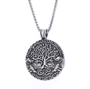Detailed close-up of tree of life stainless steel pendant with embossed dragon texture