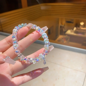 Detail of crystal bead bracelet with AB coating finish and flower pendant