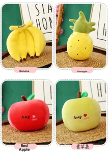 Detail view of plush fruit toys including banana, pineapple, and apples with embroidery