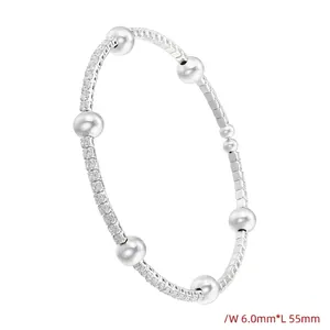Silver bracelet featuring dense micro-pave cubic zirconia and six polished round beads