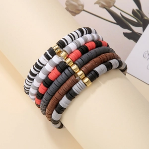 Detail view of 5-layer Bohemian Heishi clay bead bracelets in black, red and gold colors