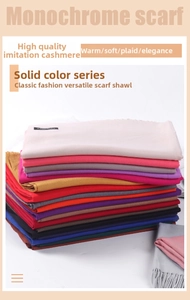 Close-up of premium imitation cashmere scarves in multiple solid colors with tassel edges