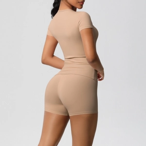 Side view of seamless apricot athletic set featuring high waist shorts and slim t-shirt
