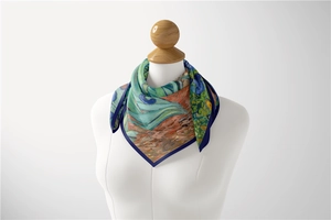 Detail of Van Gogh oil painting style silk scarf with blue border on a mannequin