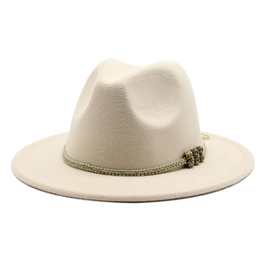 Detail of off-white wide brim fedora hat featuring a woven band and metallic beads decor