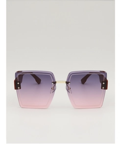 Detail showing oversized rimless sunglasses with gradient purple lenses and gold bridge