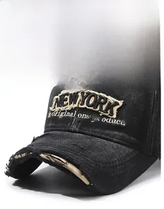 Detailed macro view of embroidered New York logo and vintage distressed denim baseball cap