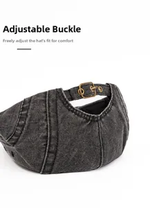 Detail of adjustable bronze metal buckle on vintage washed grey canvas newsboy cap