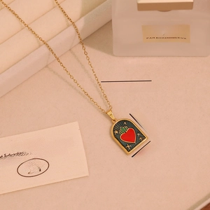 Macro view showing dimensions of heart pattern stainless steel necklace on display