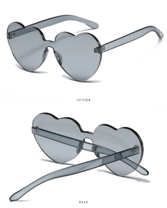 Detailed views of rimless heart sunglasses in grey showing side profile and foldable temples