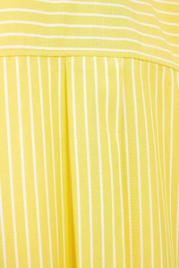 Macro view of woven yellow and white striped fabric texture with detailed stitching